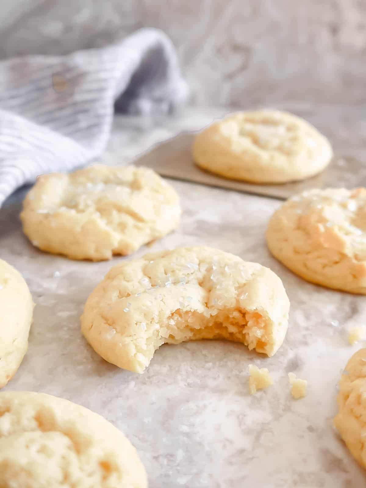 A bite taken out of soft sugar cookie.