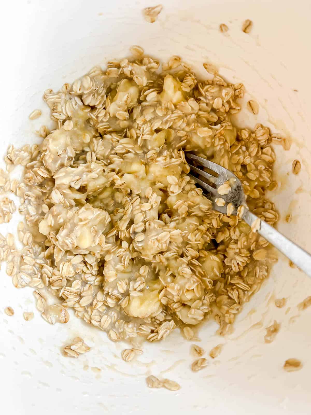Oats mixed into banana and milk.