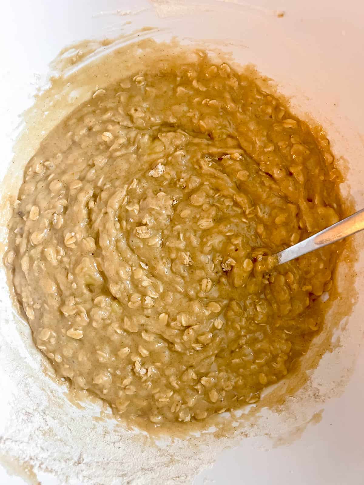 Oatmeal banana muffins batter in a bowl.