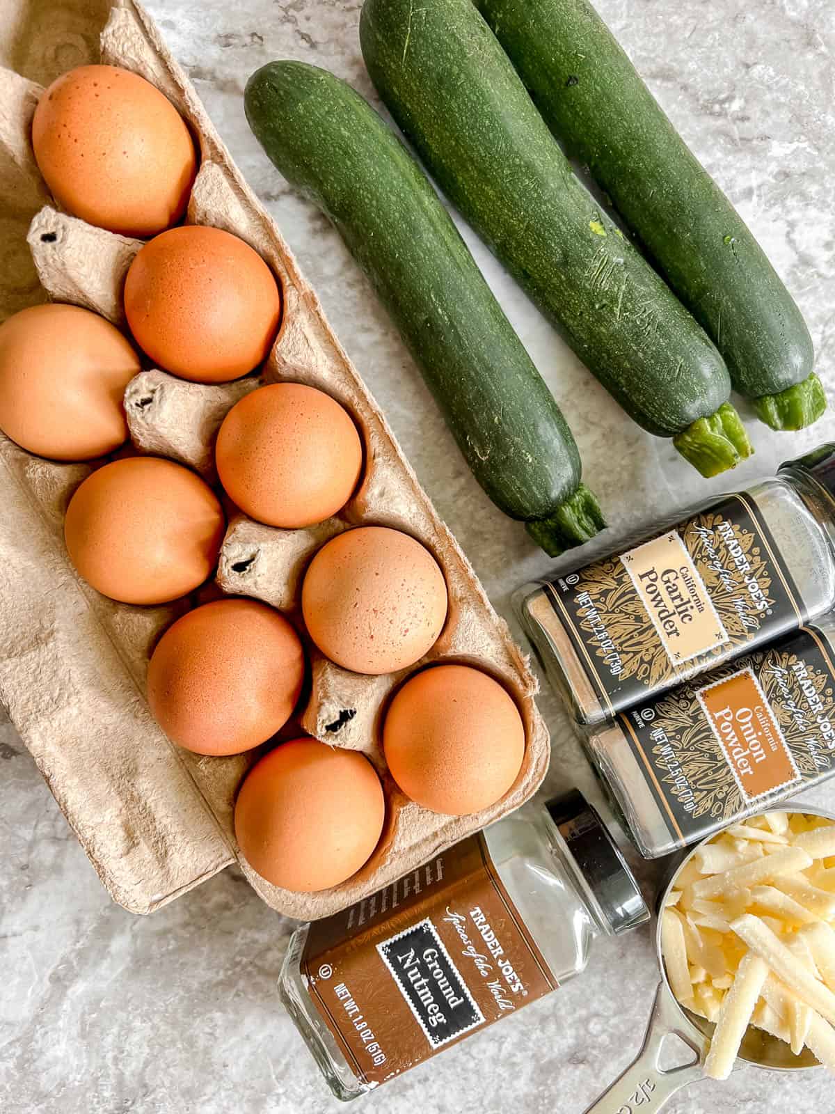 Ingredients needed to make Zucchini Egg Muffin Cups.
