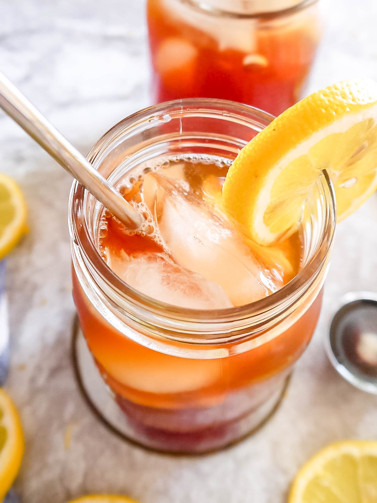 Sugar free iced tea in a glass with lemon.