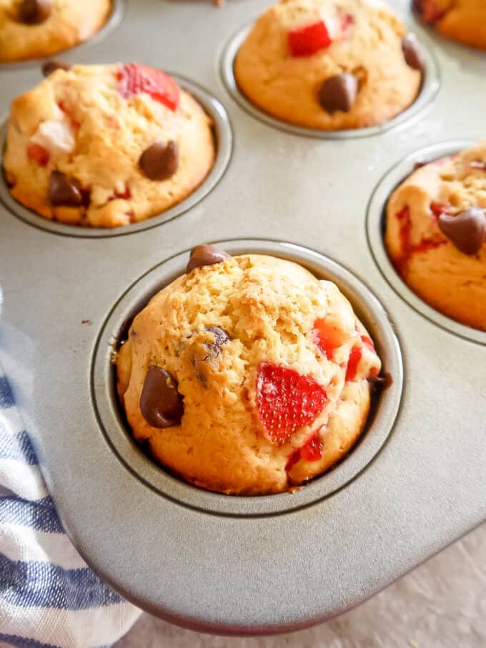 side angle of strawberry muffins in tin pan