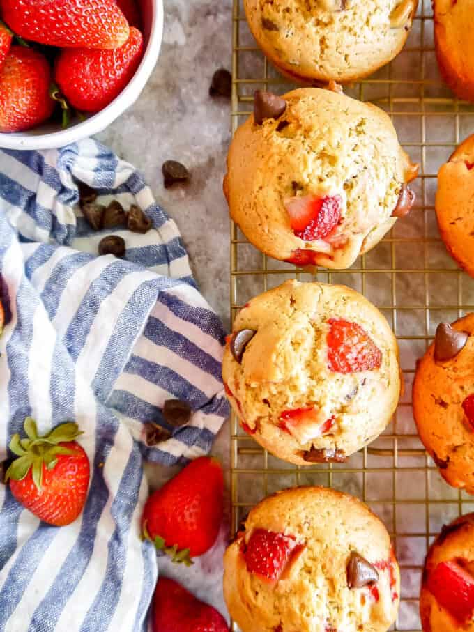 strawberry chocolate chip muffins cooling off on cooling rack