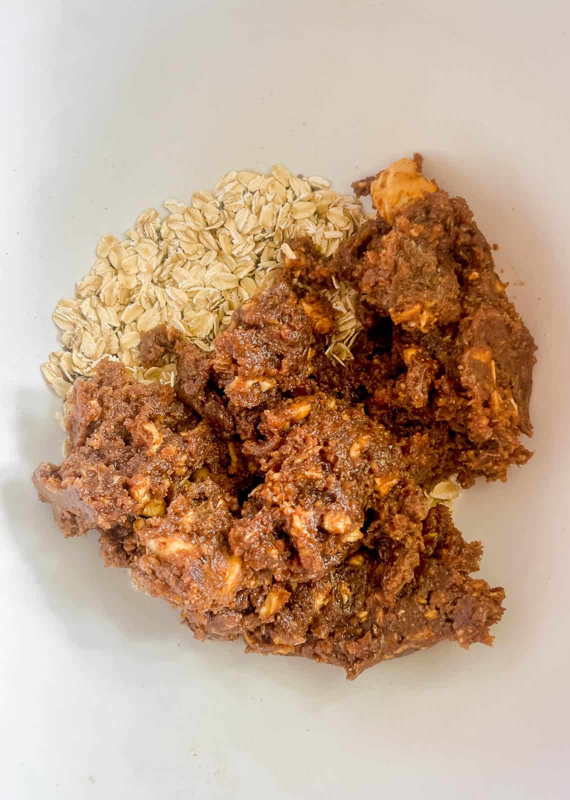 Date paste on top of rolled oats.