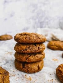 Paleo pumpkin molasses cookies stacked on top of each other.