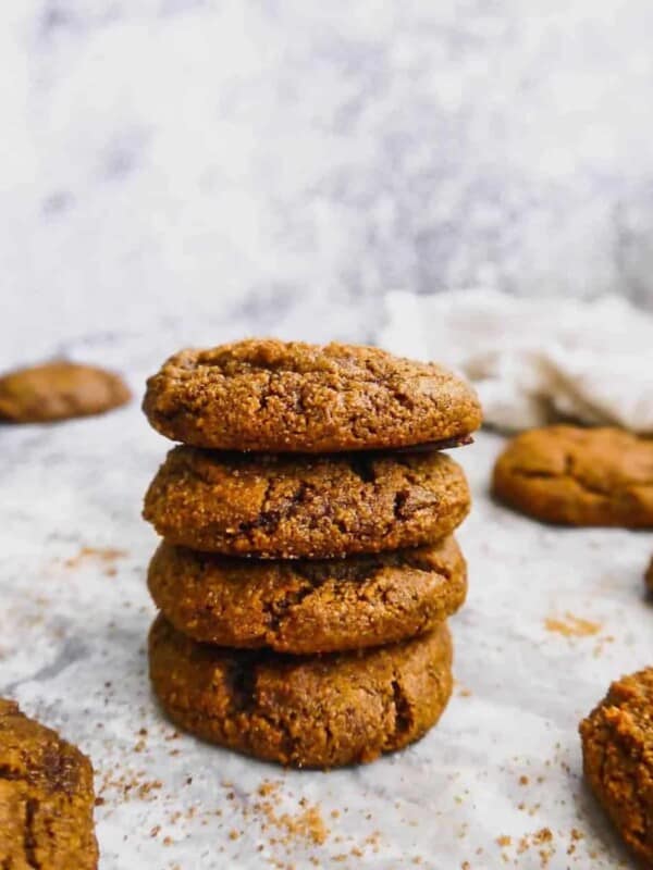 Paleo pumpkin molasses cookies stacked on top of each other.