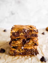 Almond Flour Egg Yolk Chocolate Chip Cookie Bars stacked on top of each other