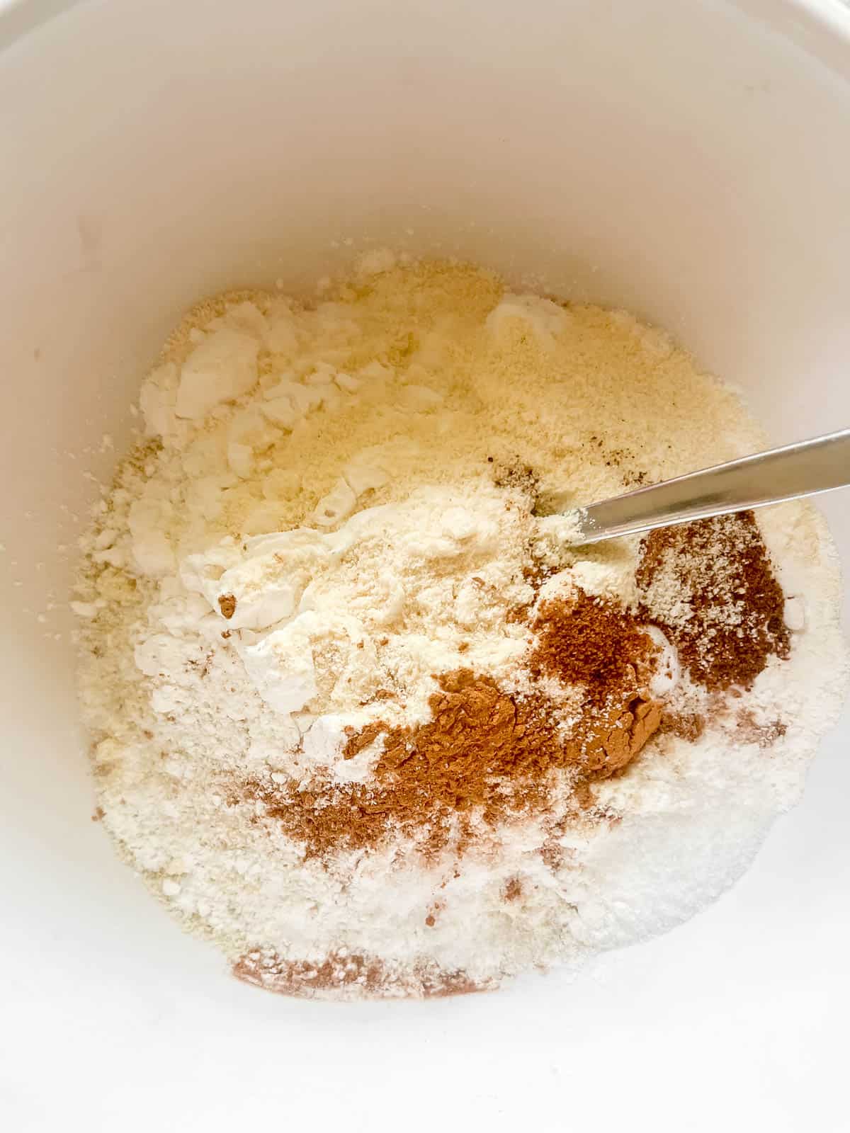 Carrot banana bread dry ingredients in a bowl.