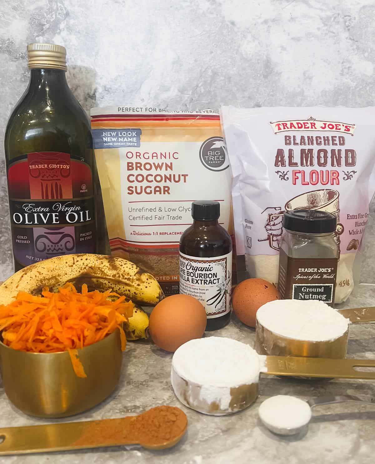 Ingredients needed to make healthy carrot banana bread.