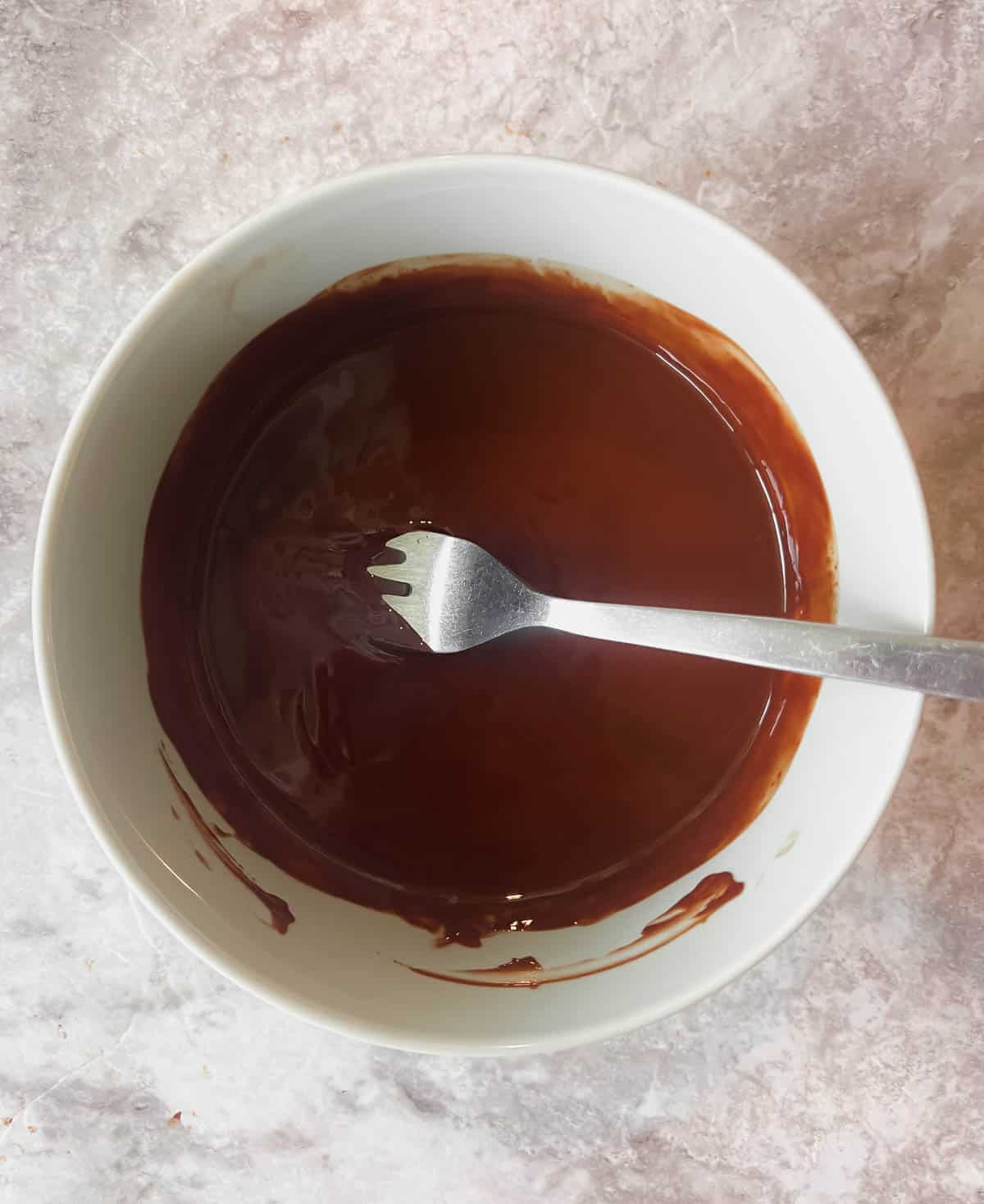 Melted chocolate mixed with coconut oil.