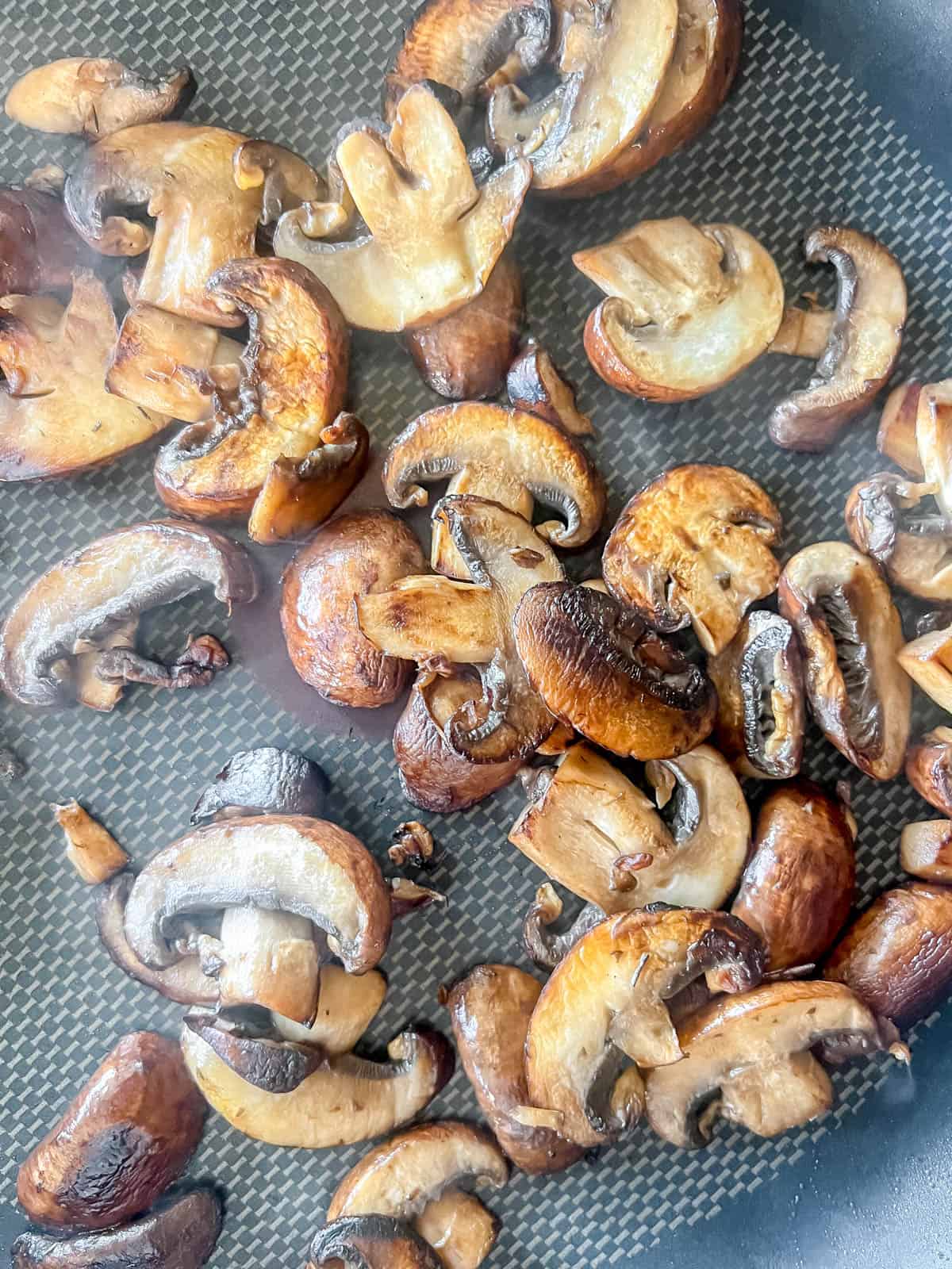 Grilled mushrooms in a pan.