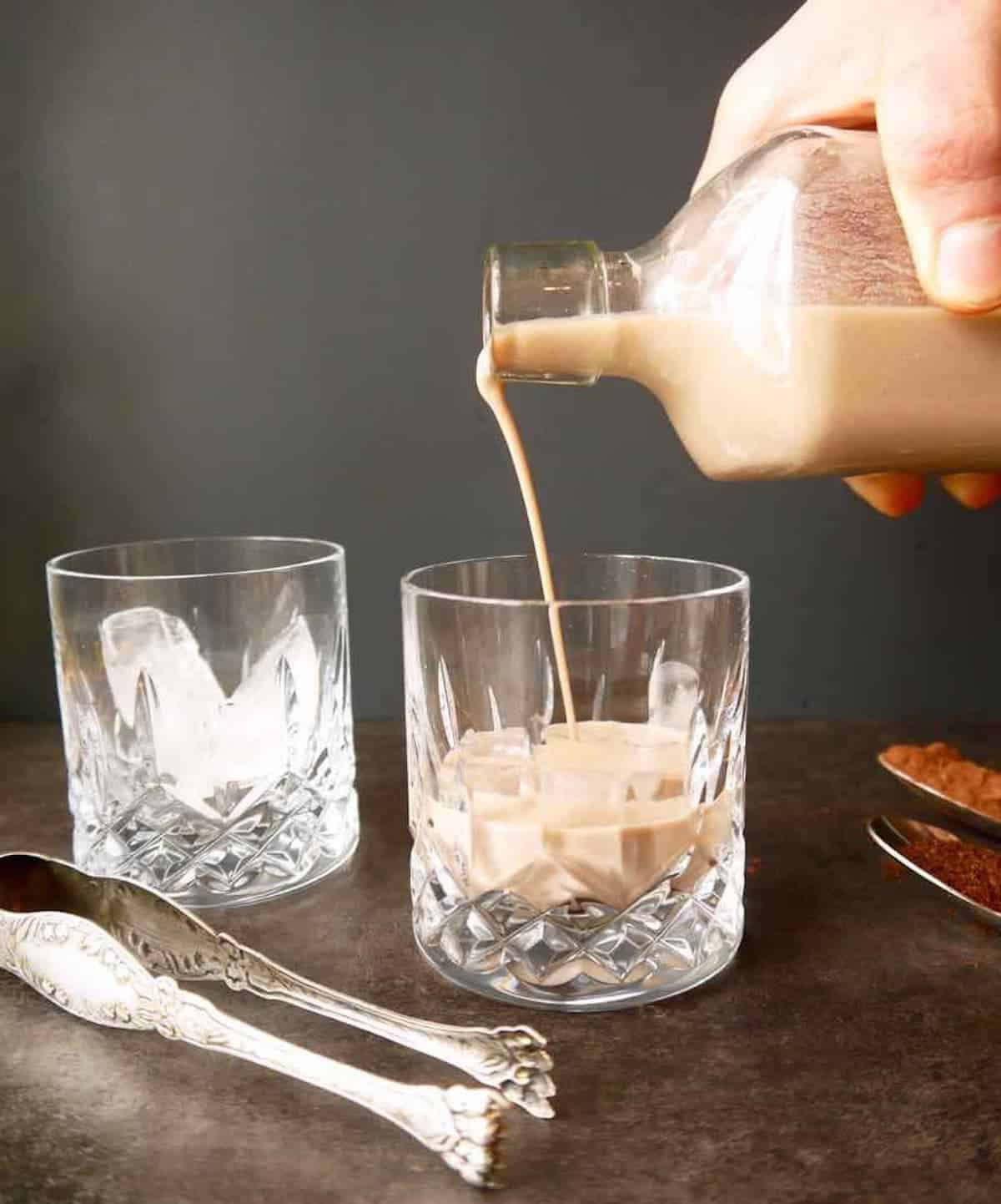 Dairy free Irish cream being poured into a glass.
