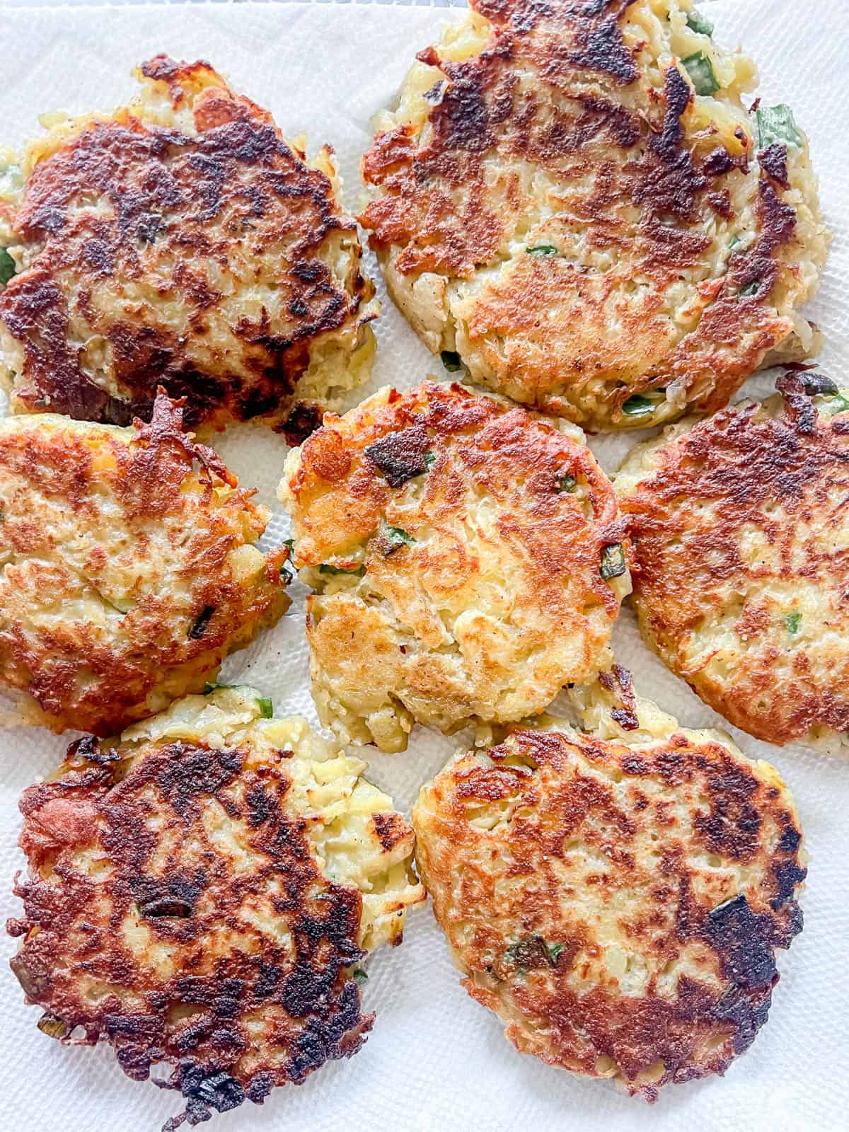 Cooked healthy potato pancakes on a paper towel.
