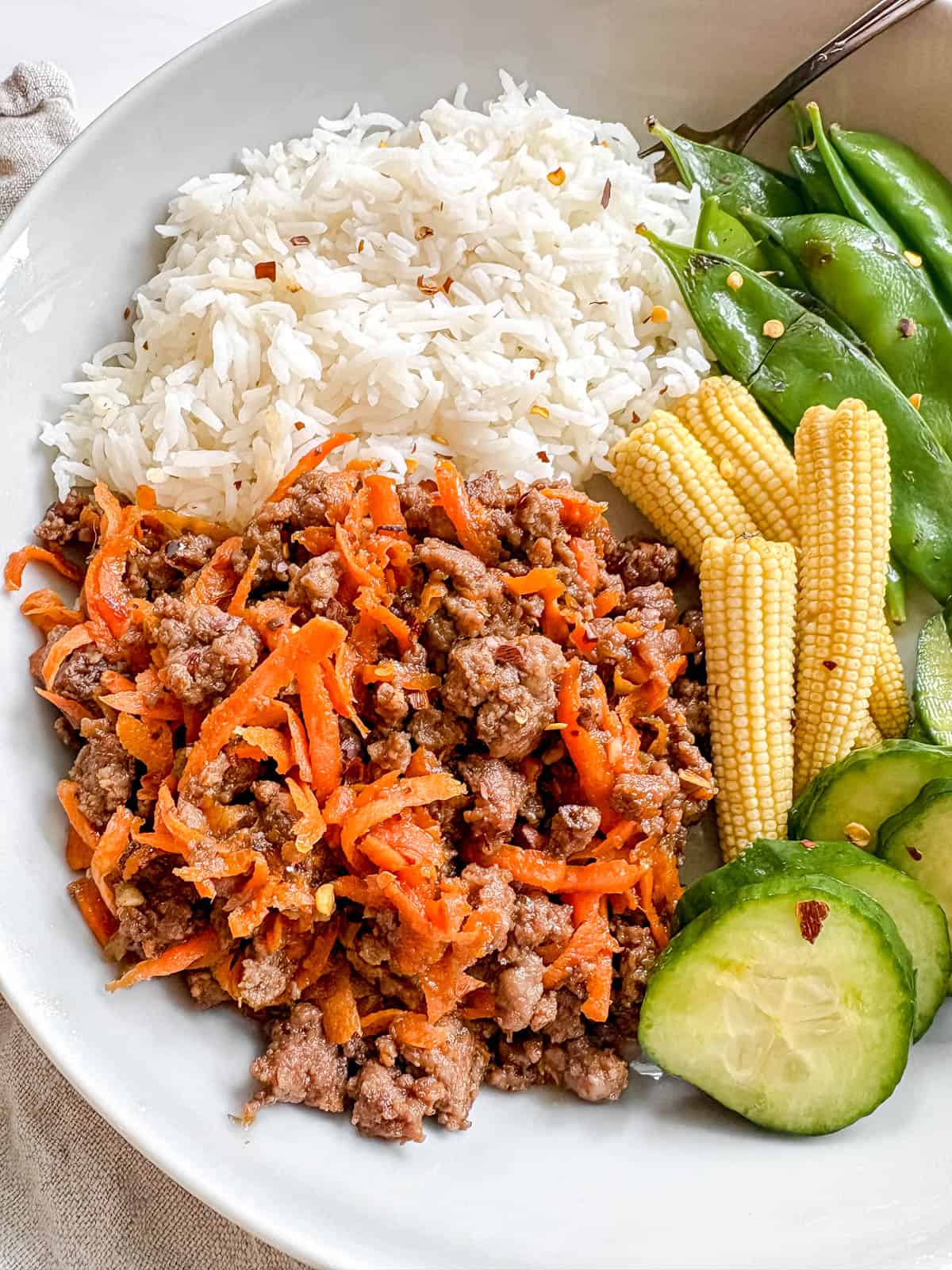 Korean beef bowl with coconut aminos and carrots.