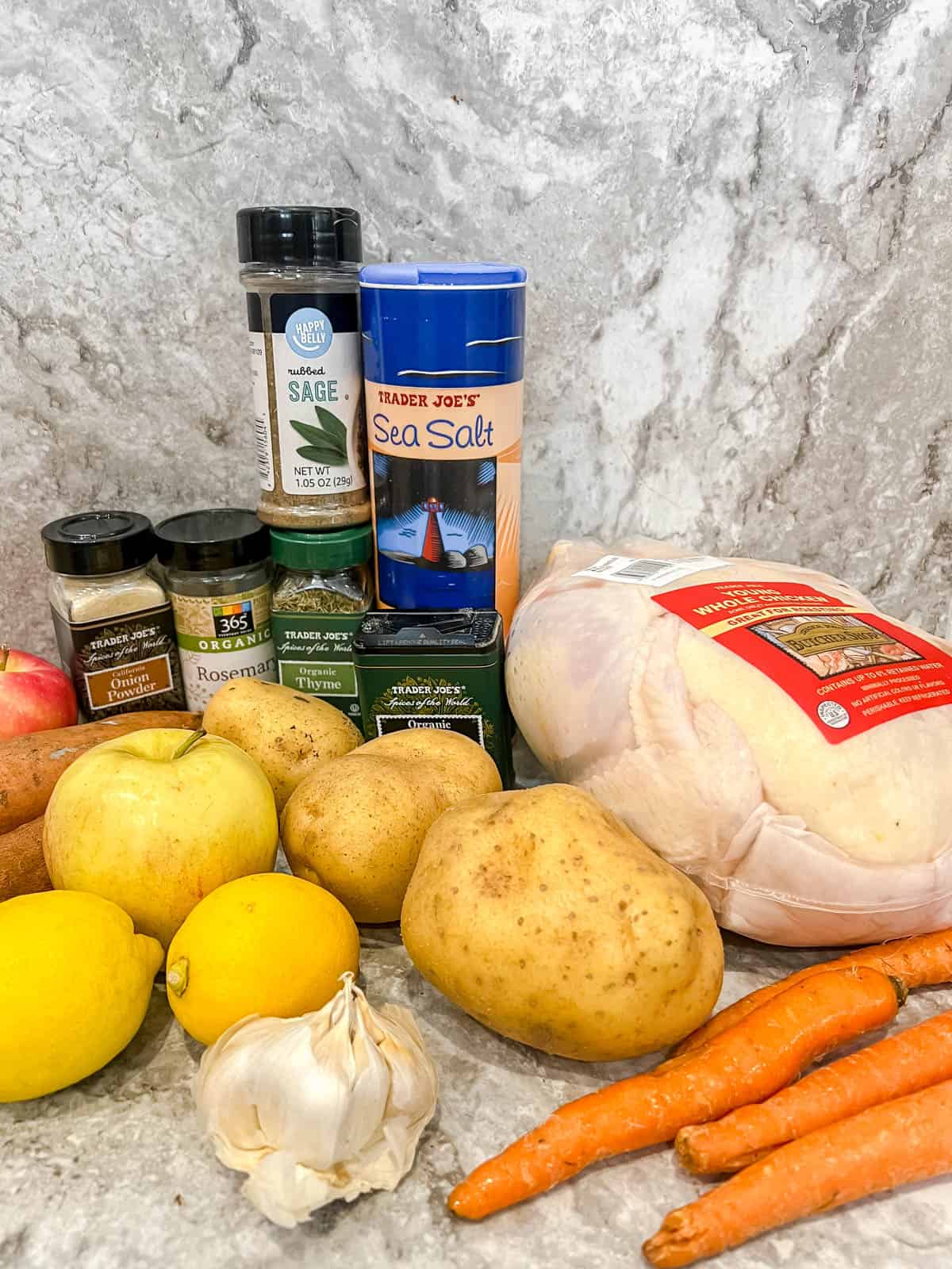 Ingredients needed to make Roast Whole Chicken with Potatoes and Apples.