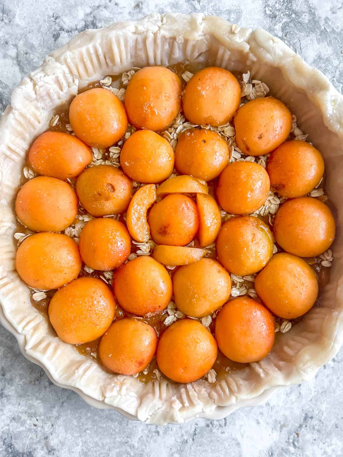 A layer of oats and apricots added to the tart.