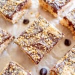 S'mores rice krispie treats cut into squares on parchment paper.