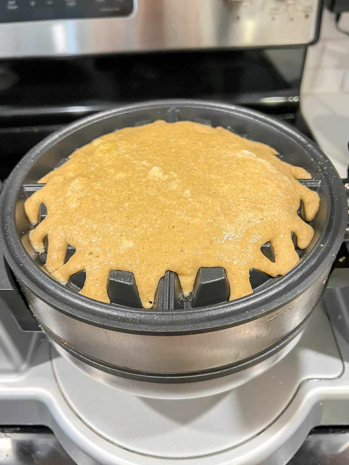 Paleo waffle batter in the waffle maker.