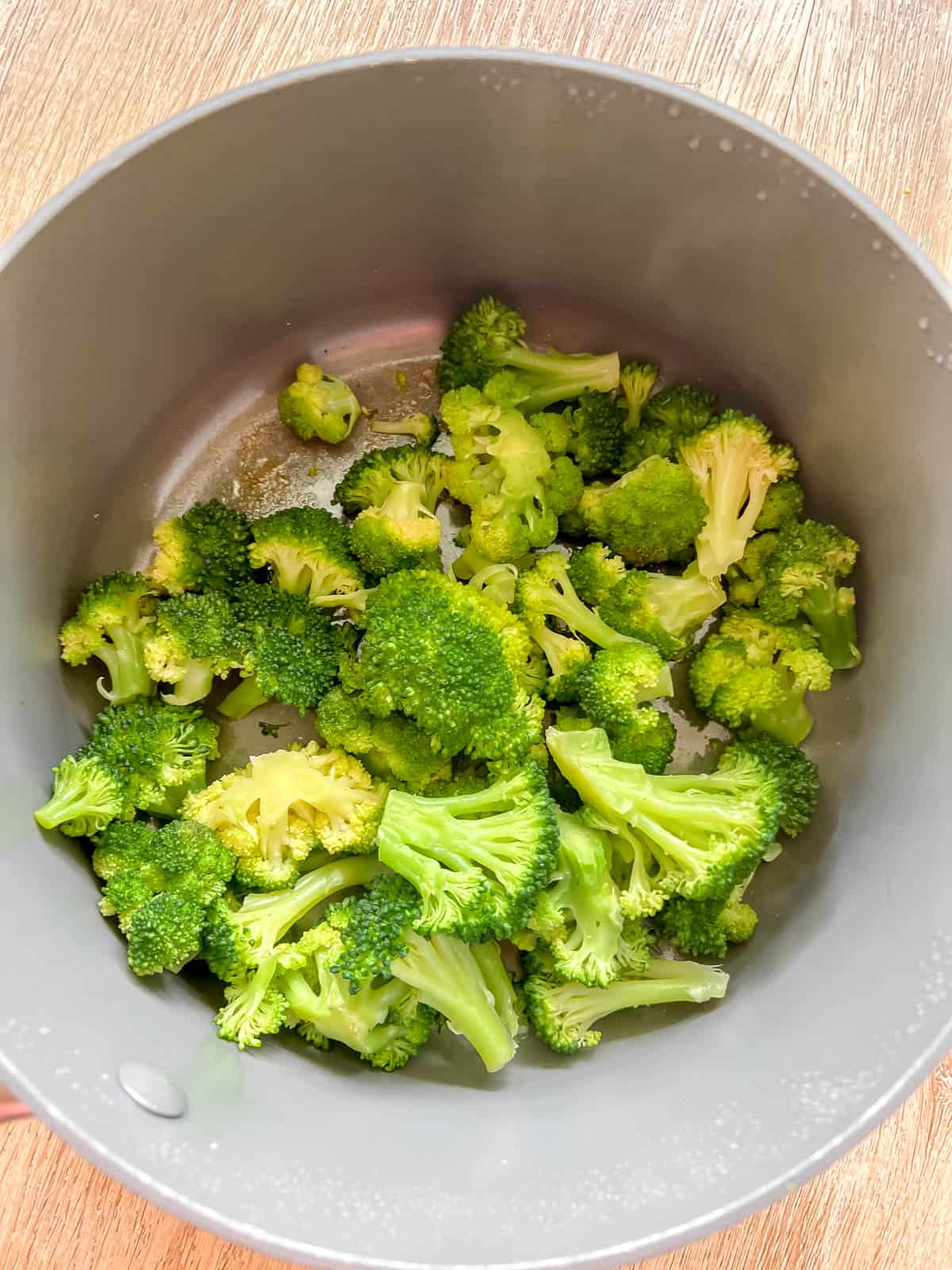 Steamed broccoli in a pan.