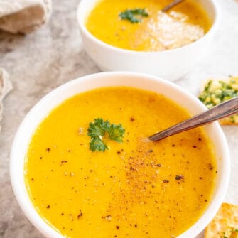 High protein butternut squash soup in two bowls.