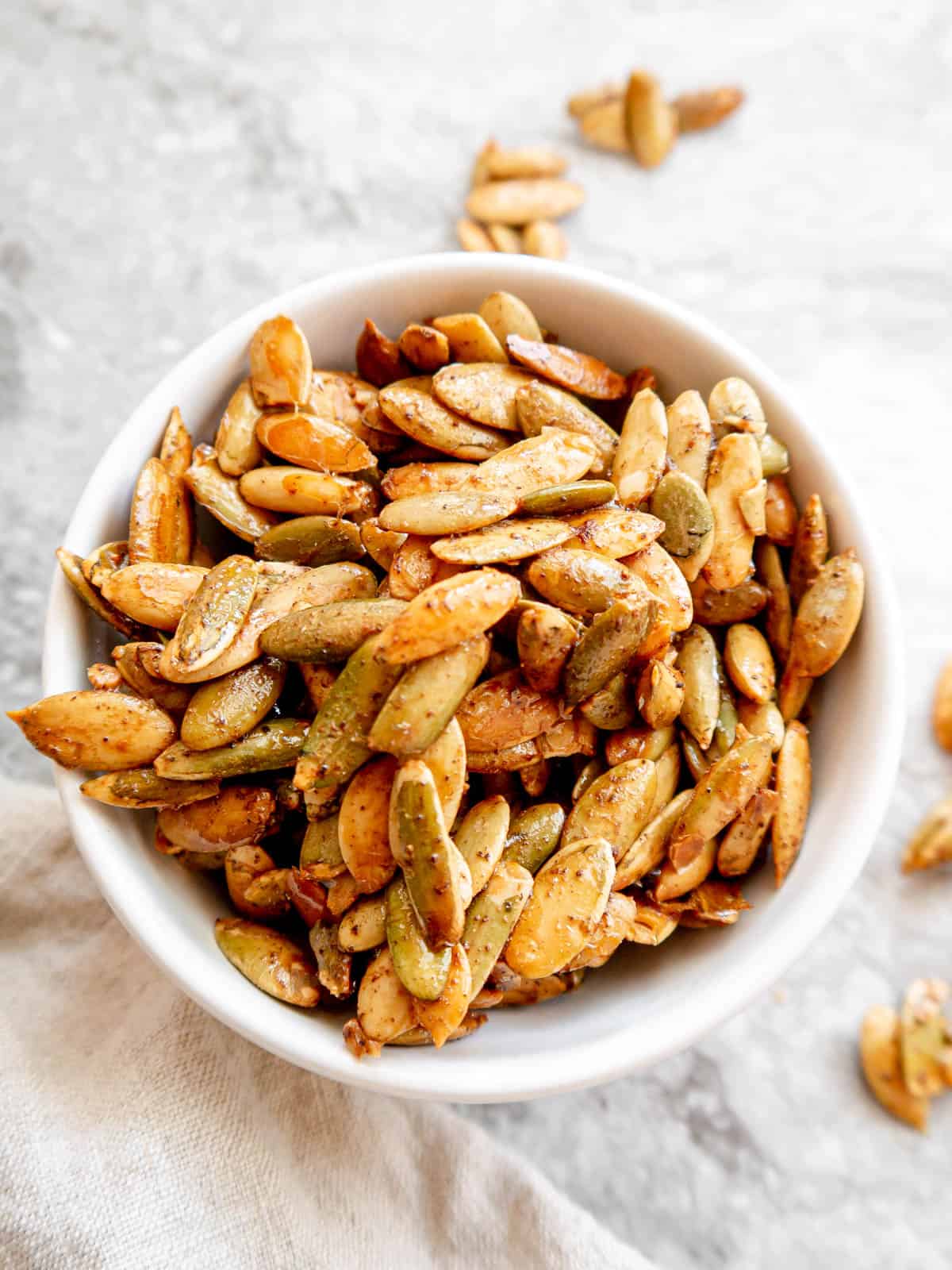 Maple roasted pumpkin seeds in a bowl.