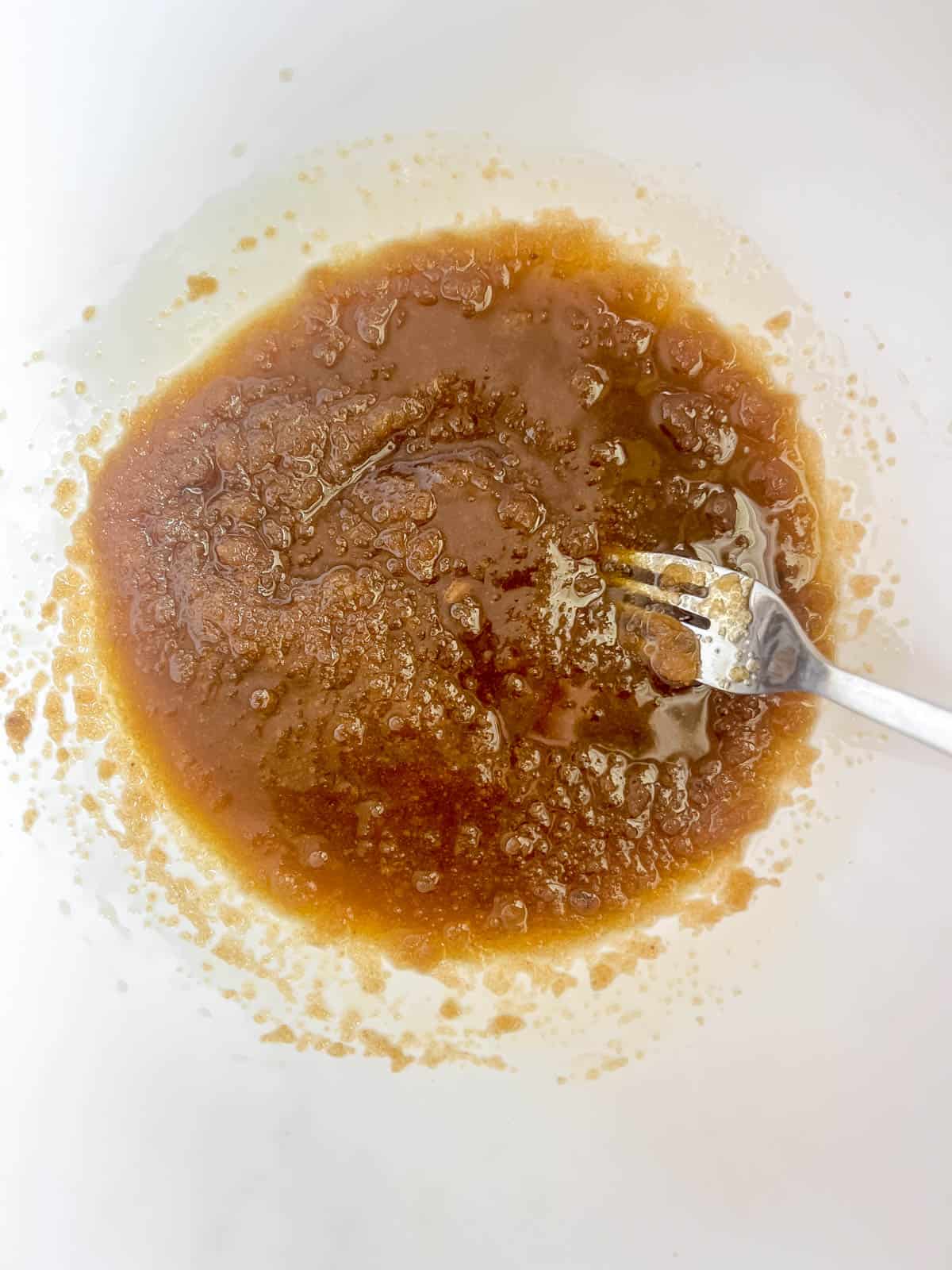 Brown sugar mixed into olive oil.