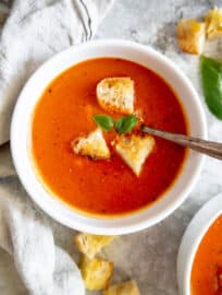 Creamy easy tomato soup in a bowl topped in croutons.