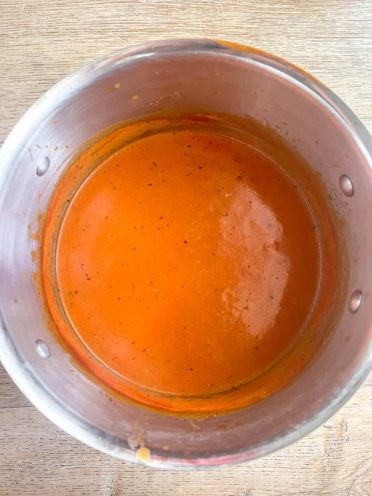 Quick tomato soup cooking in a pan.