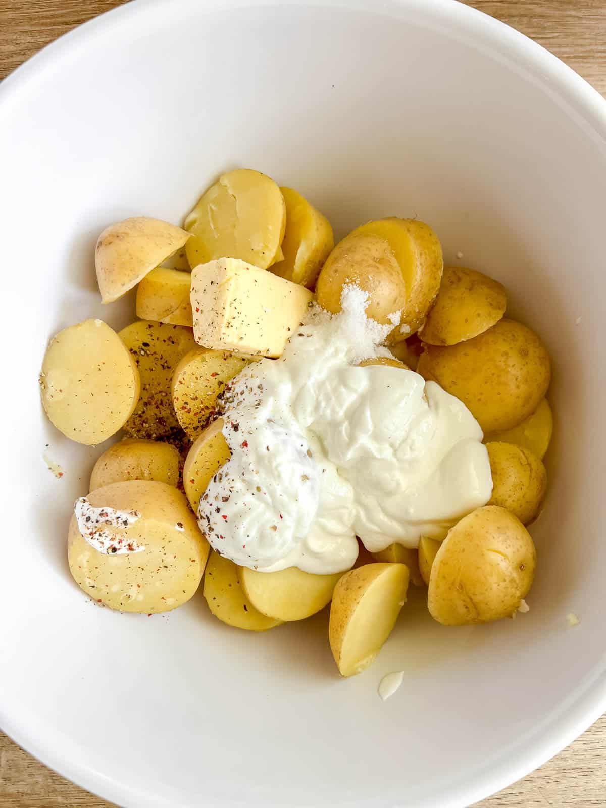 Greek yogurt, butter and milk on top of potatoes.