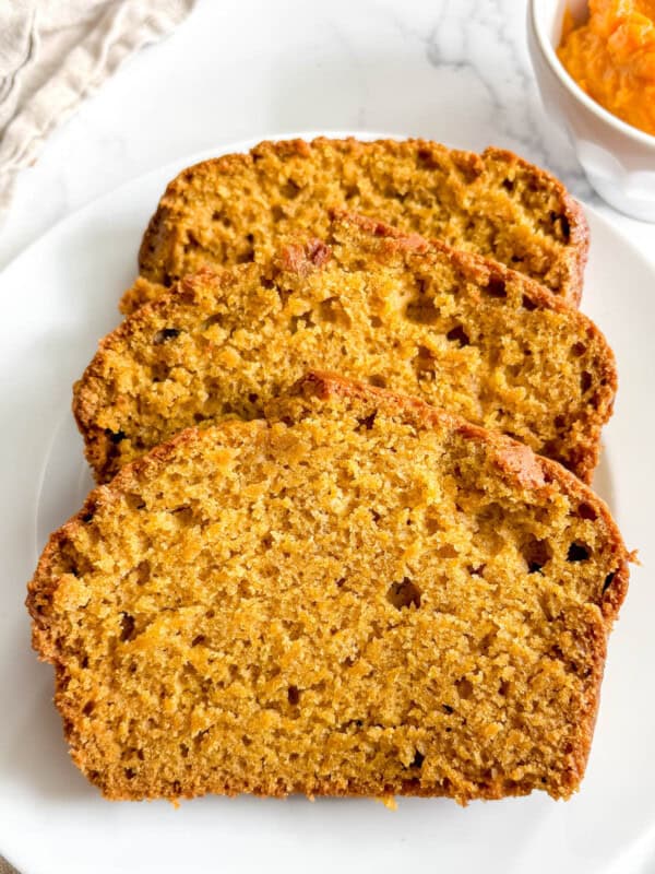 Slices of dairy-free pumpkin bread on a plate.