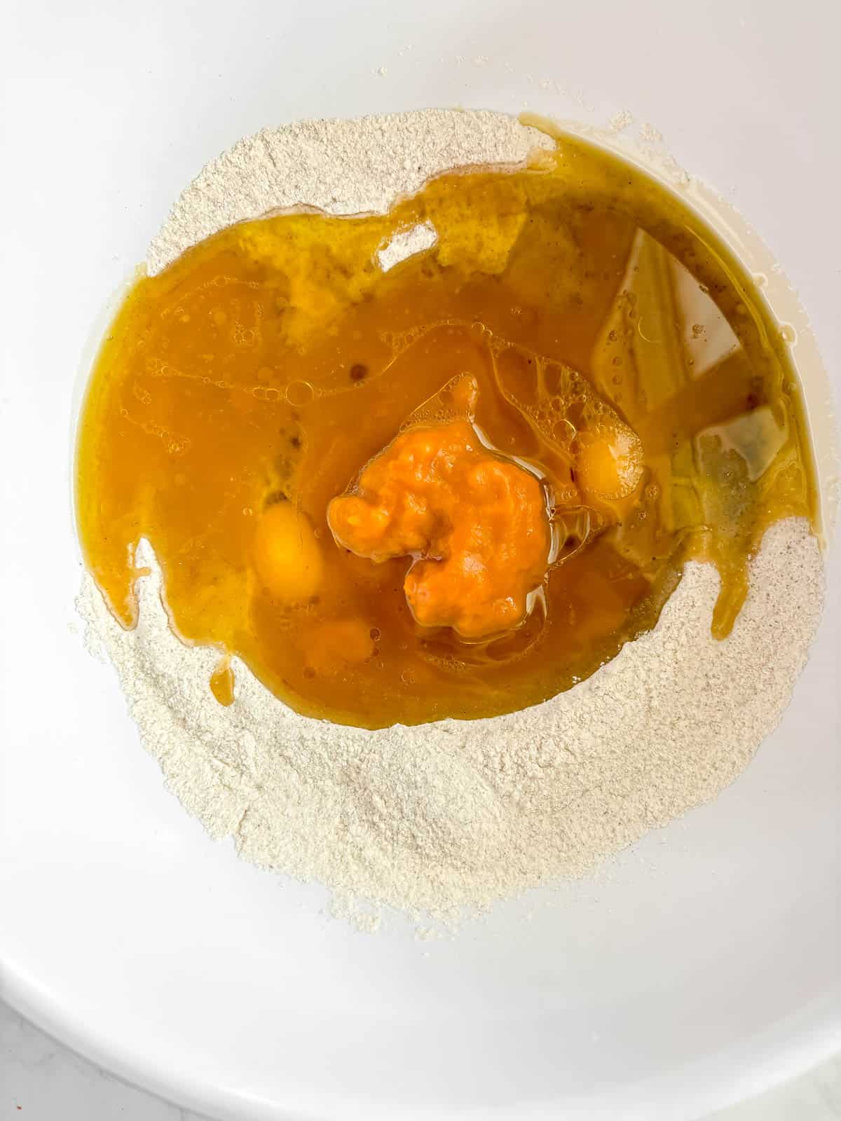 Wet ingredients added to the well.