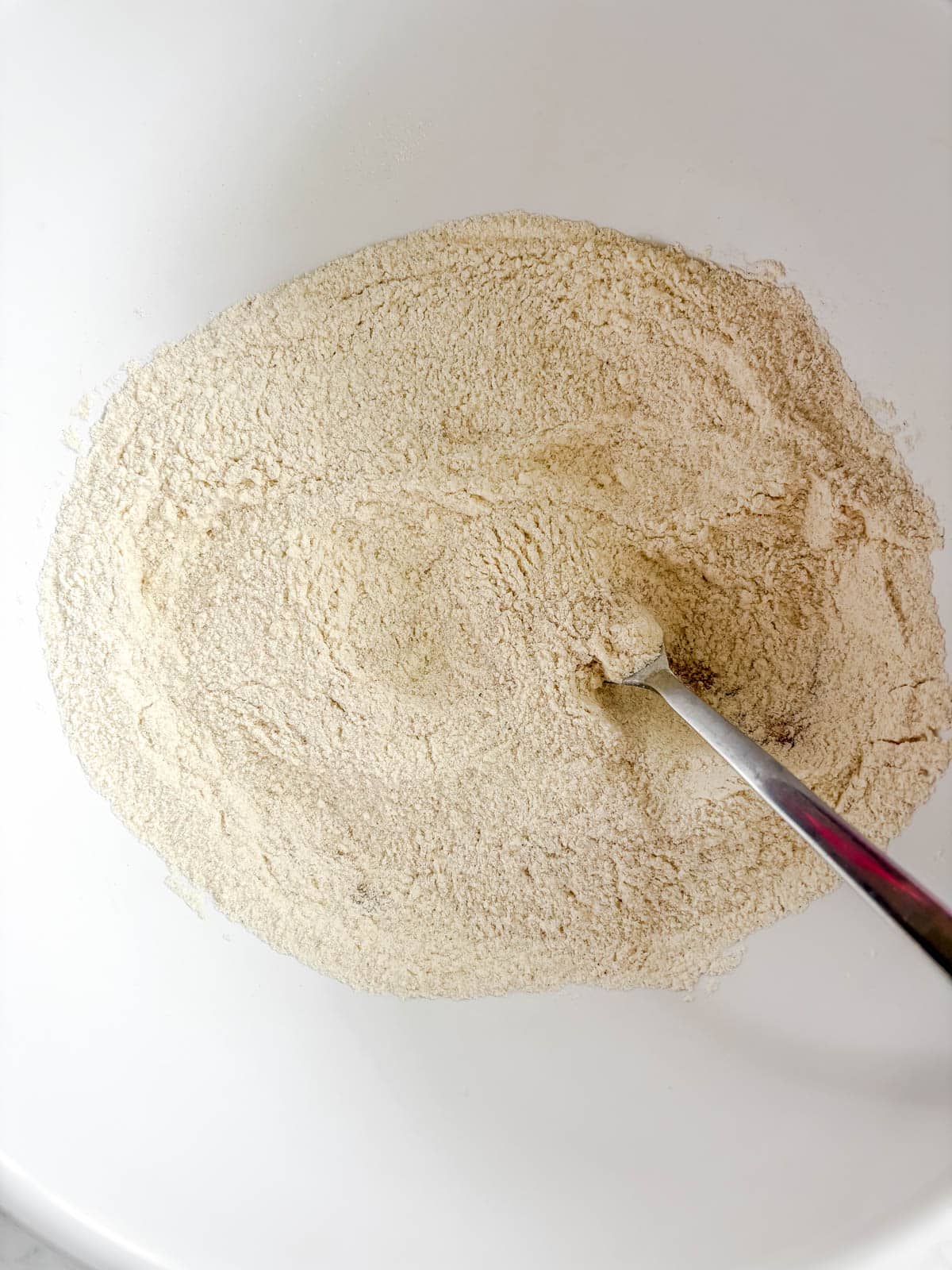 Dry ingredients for dairy-free pumpkin bread in a bowl.