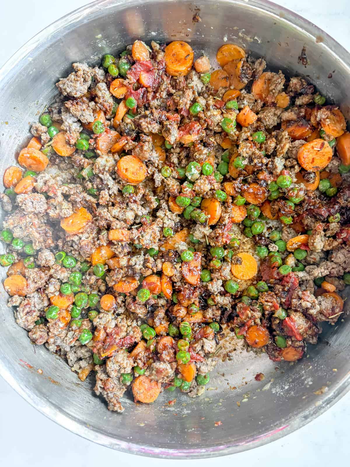 Tomato paste and blackstrap molasses added to the beef.