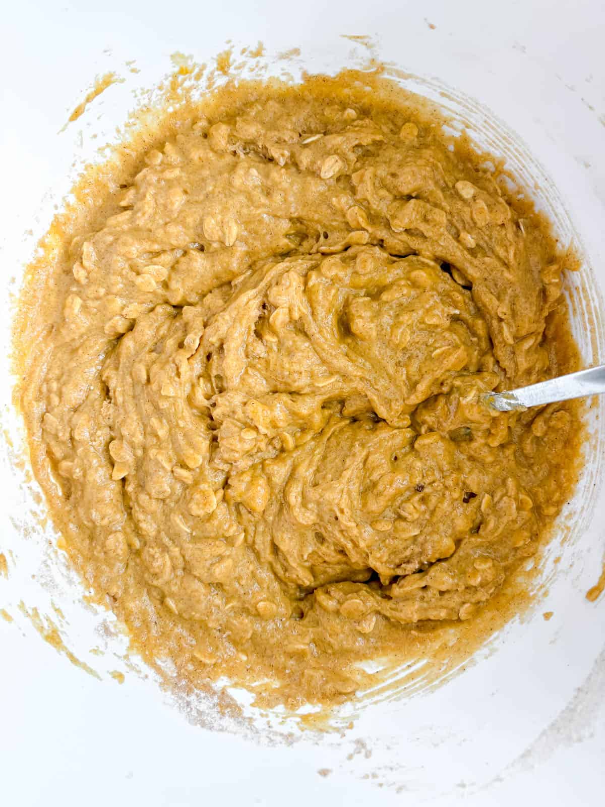 Pumpkin oat muffin batter in a bowl.