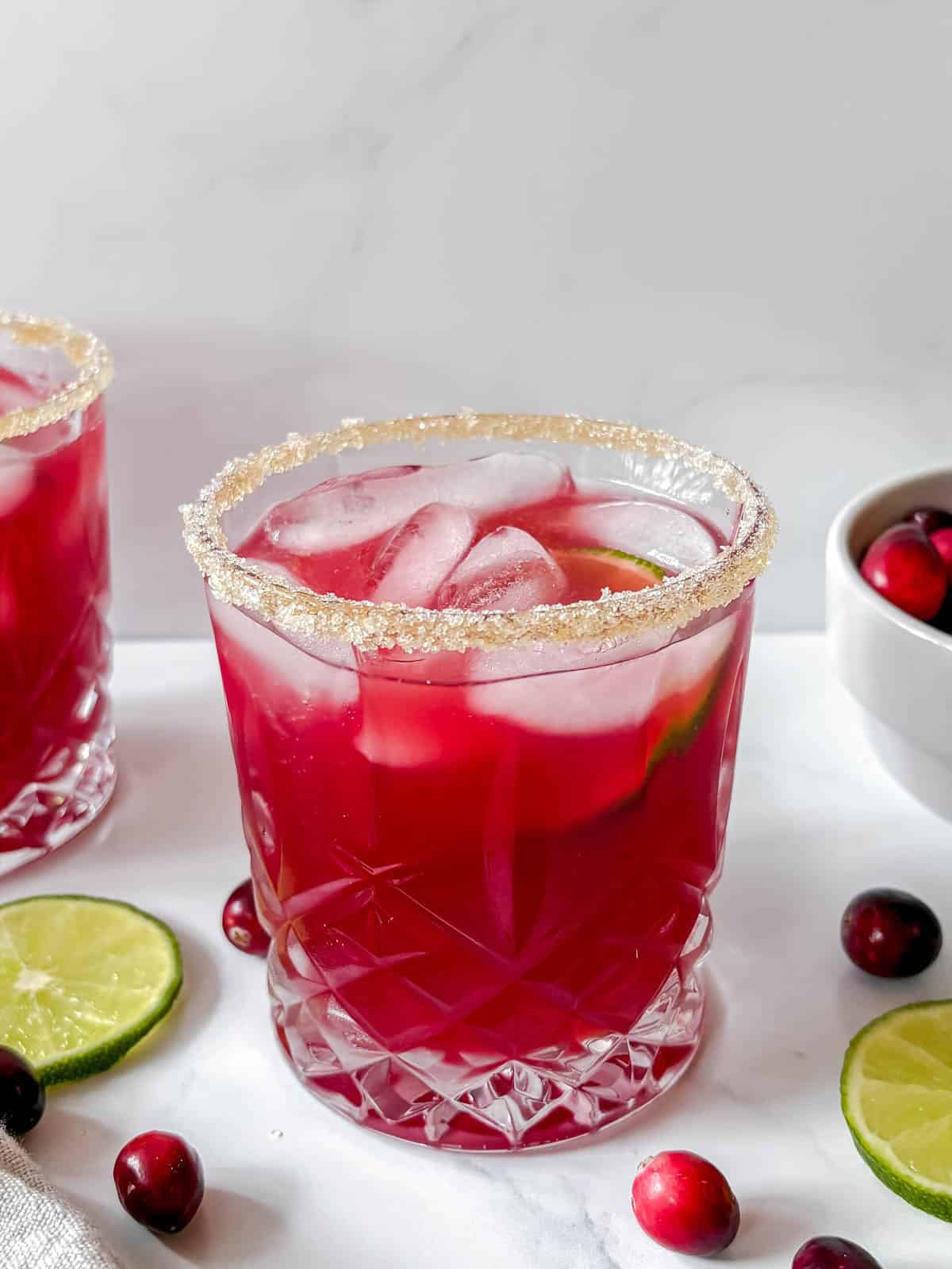 Cranberry margaritas cocktail with sugar on the rim.