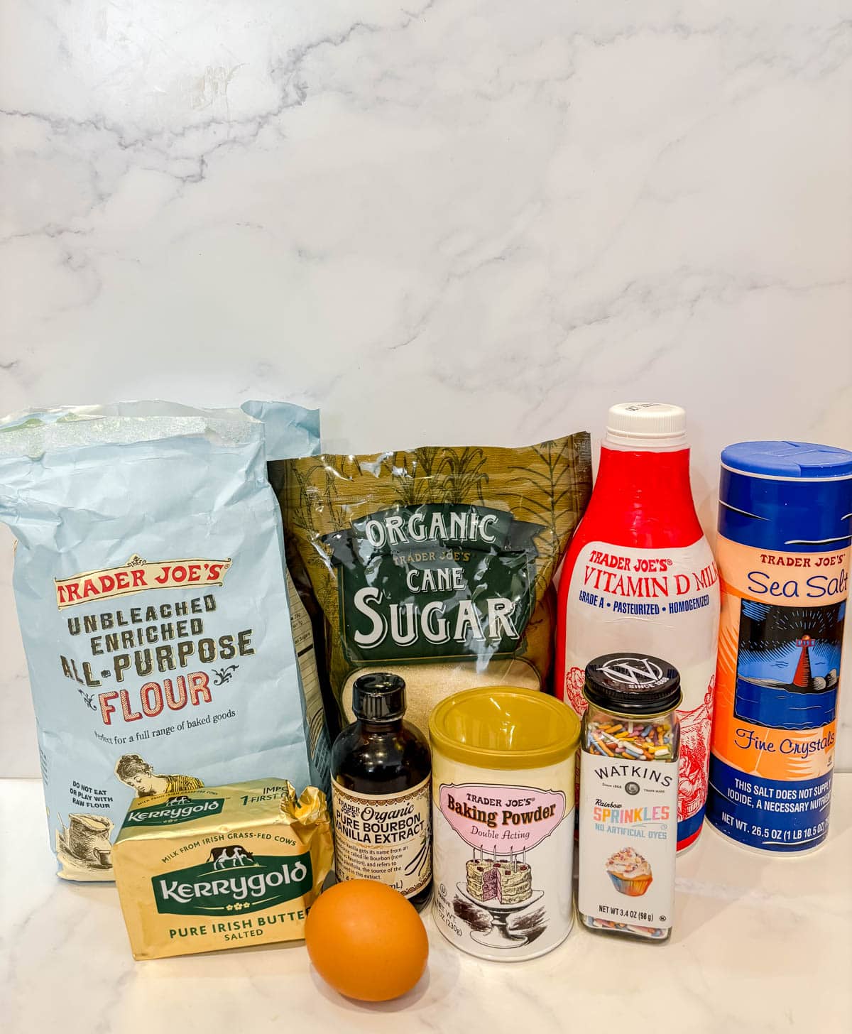 Ingredients needed to make small batch funfetti cupcakes.