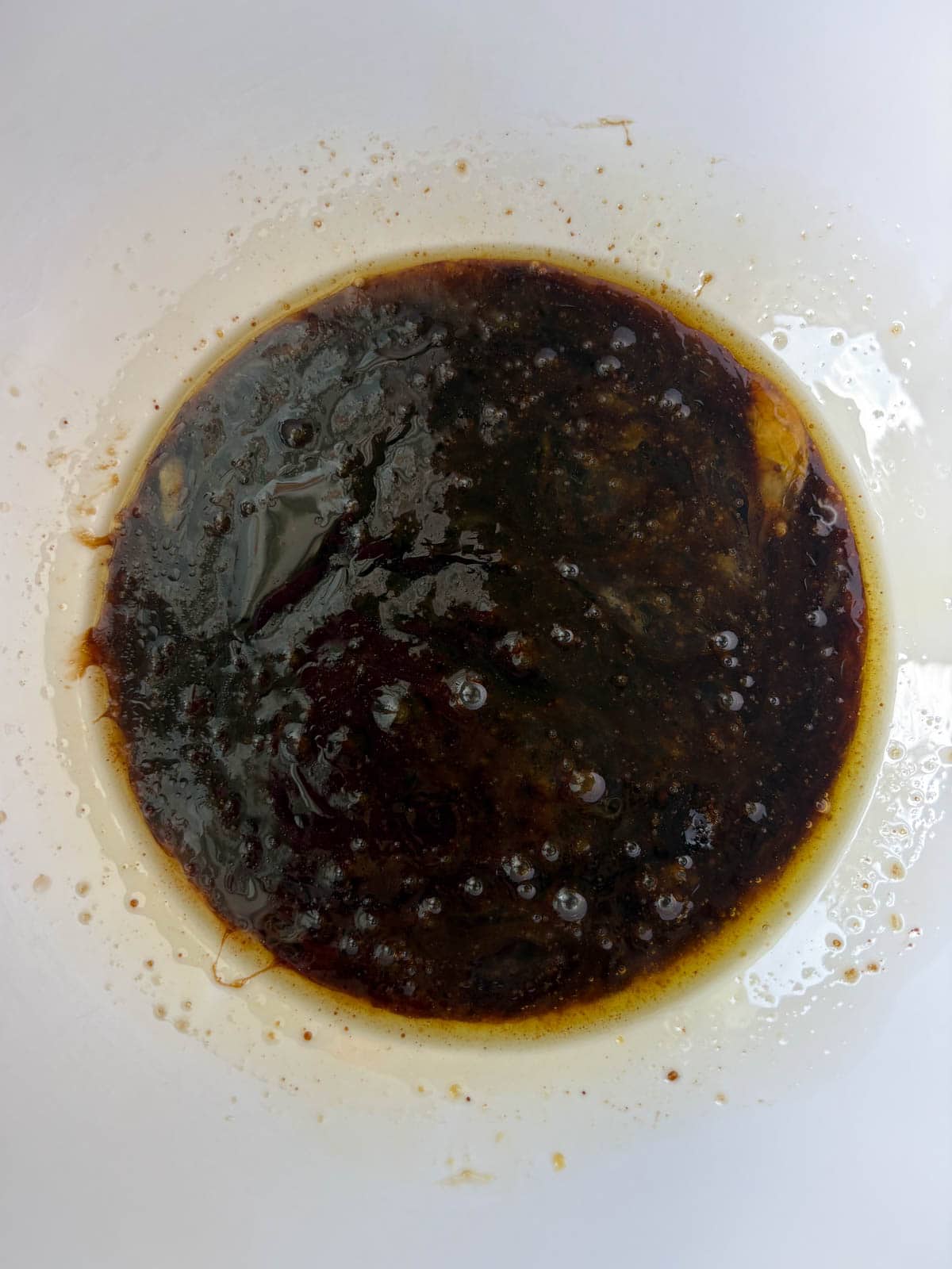 Wet ingredients in a bowl for Gingerbread Cake with Cinnamon Cream Cheese Frosting.