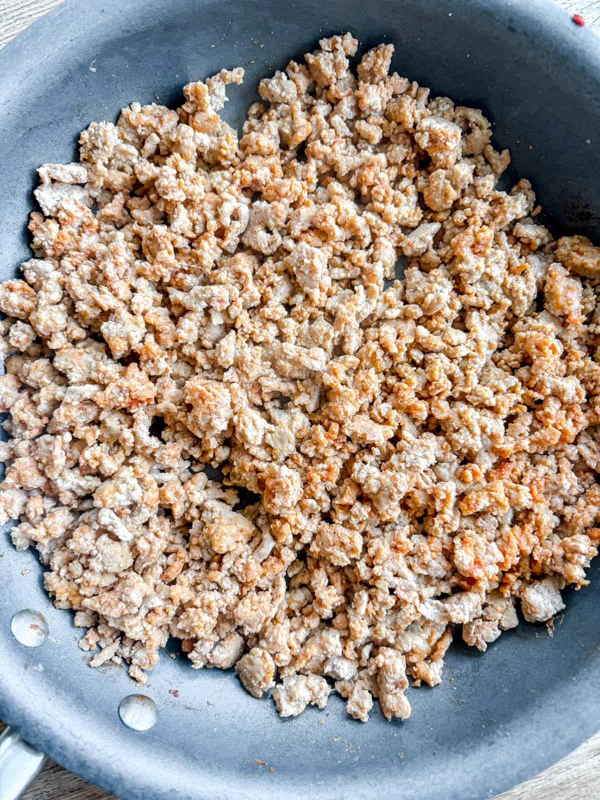 Ground turkey in a pan.