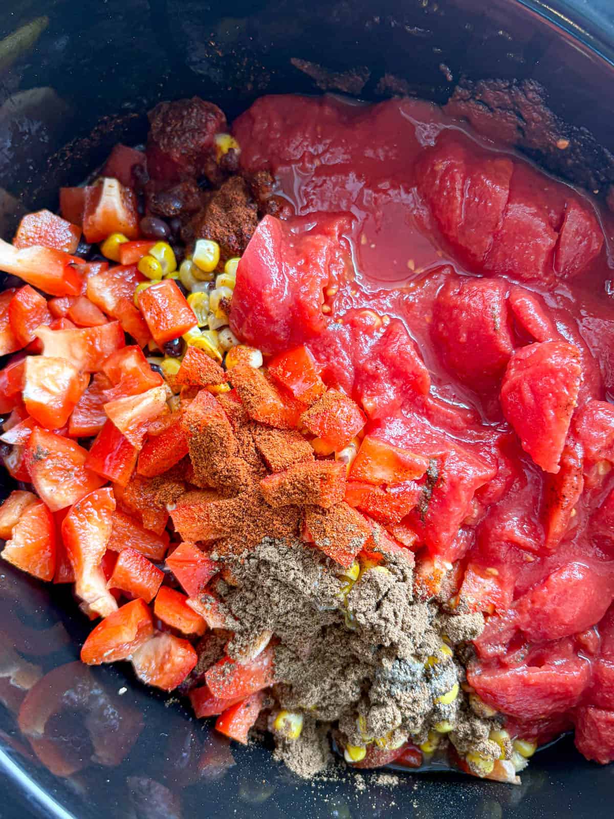 Ingredients for slow cooker turkey chili in a slow cooker.