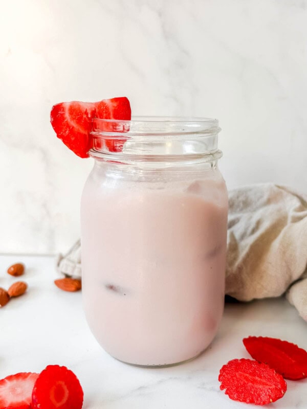 Strawberry almond milk in a mason jar.
