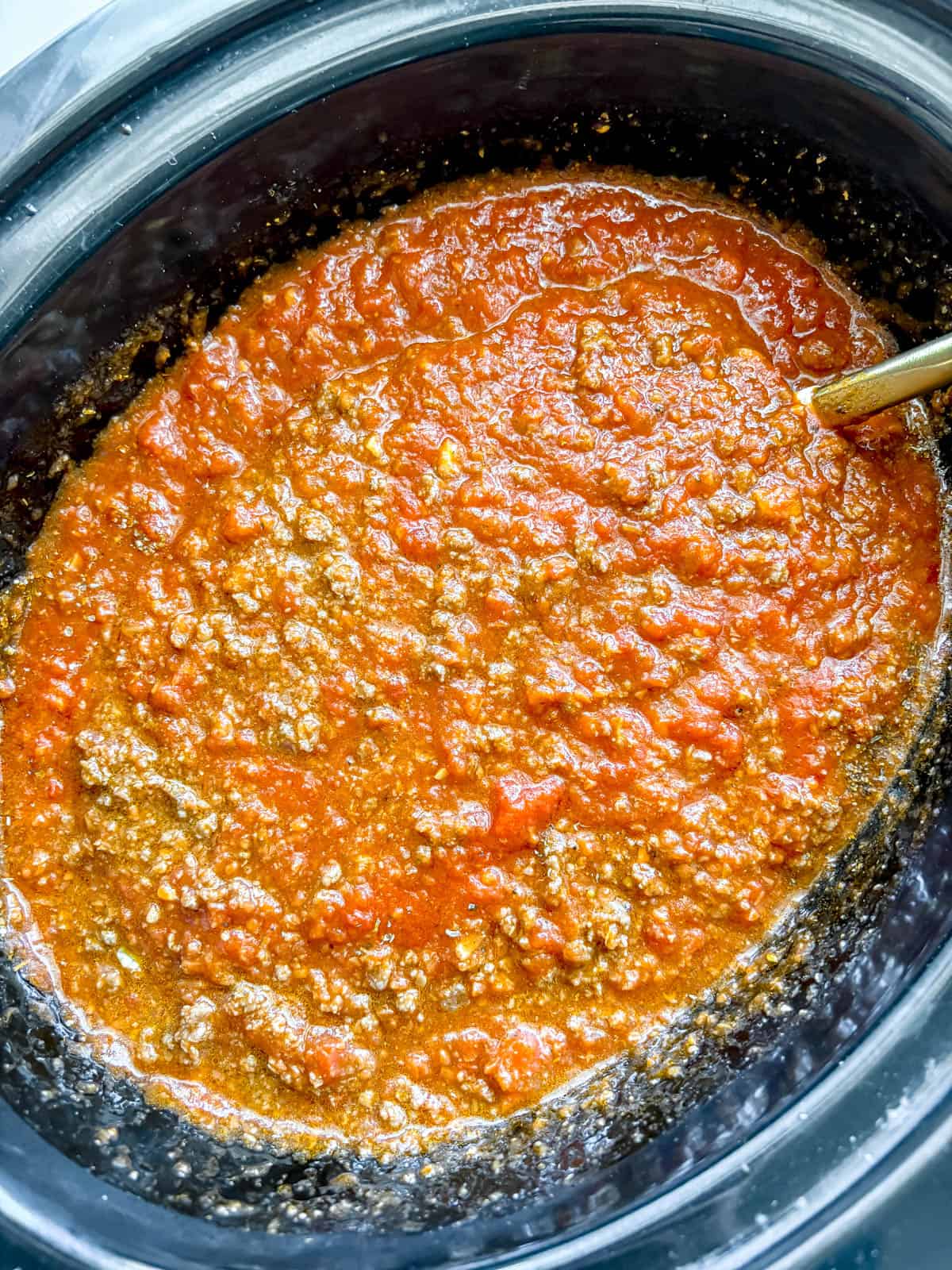 The slow cooker meat sauce prior to cooking.