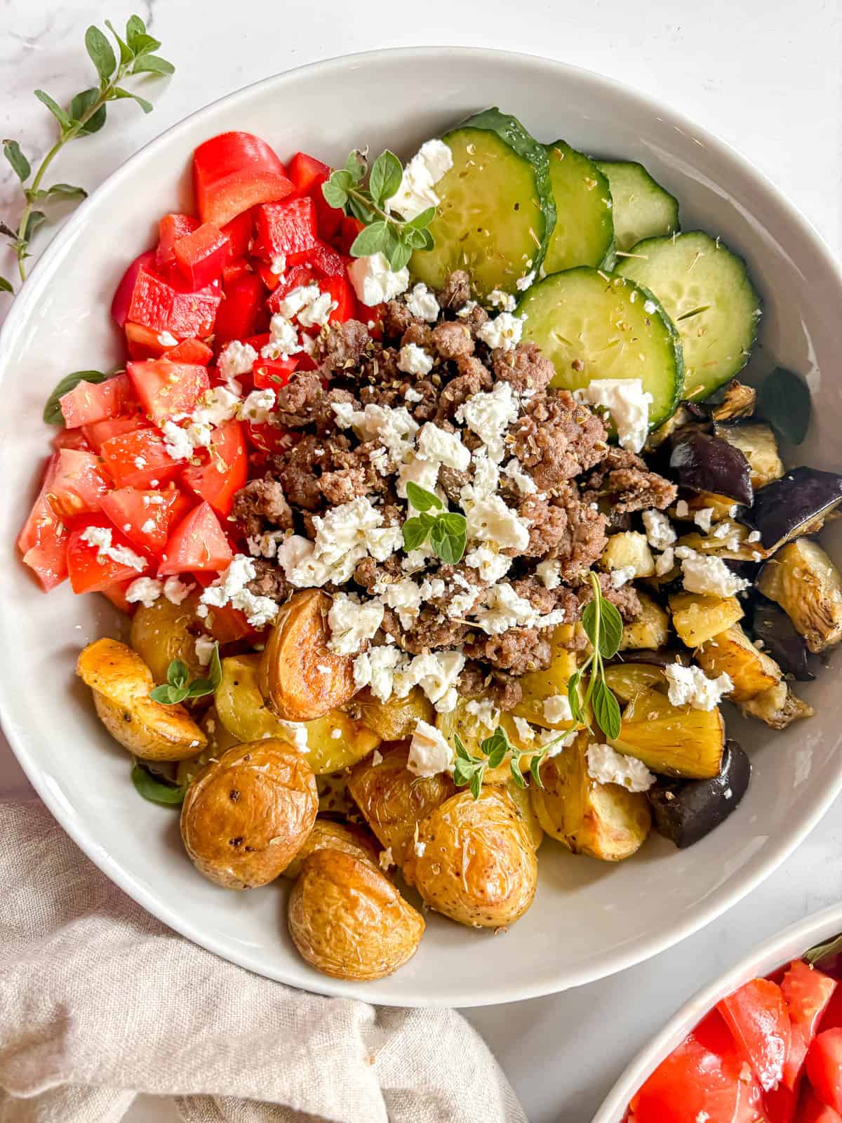 Healthy ground beef bowl filled with Mediterranean flavor