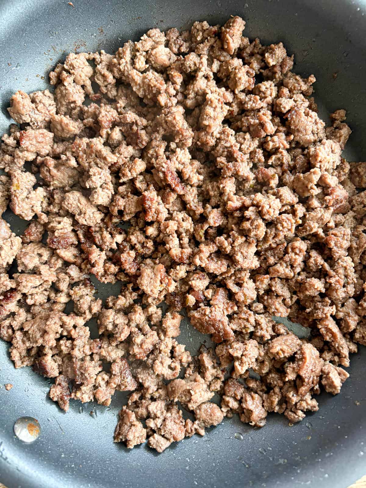 Ground beef cooked and a bit crispy in a pan.