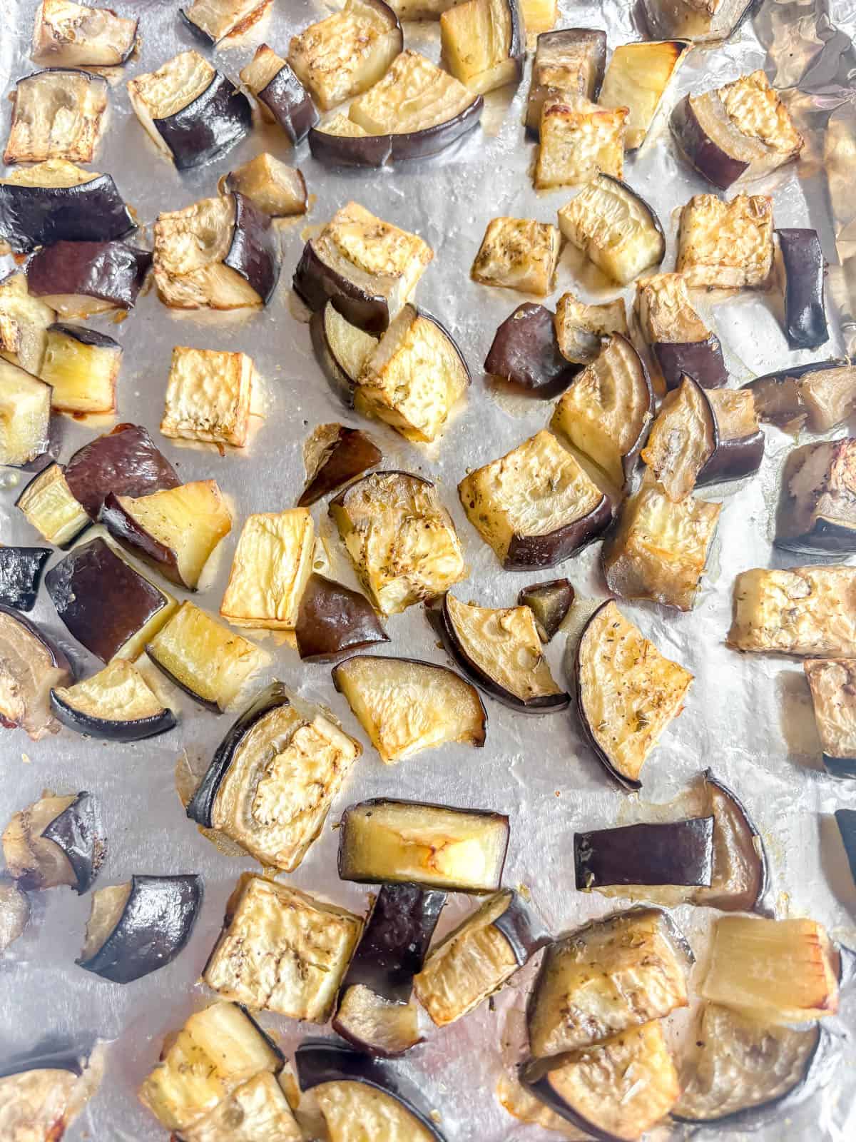 Roasted eggplant on a cookie sheet.