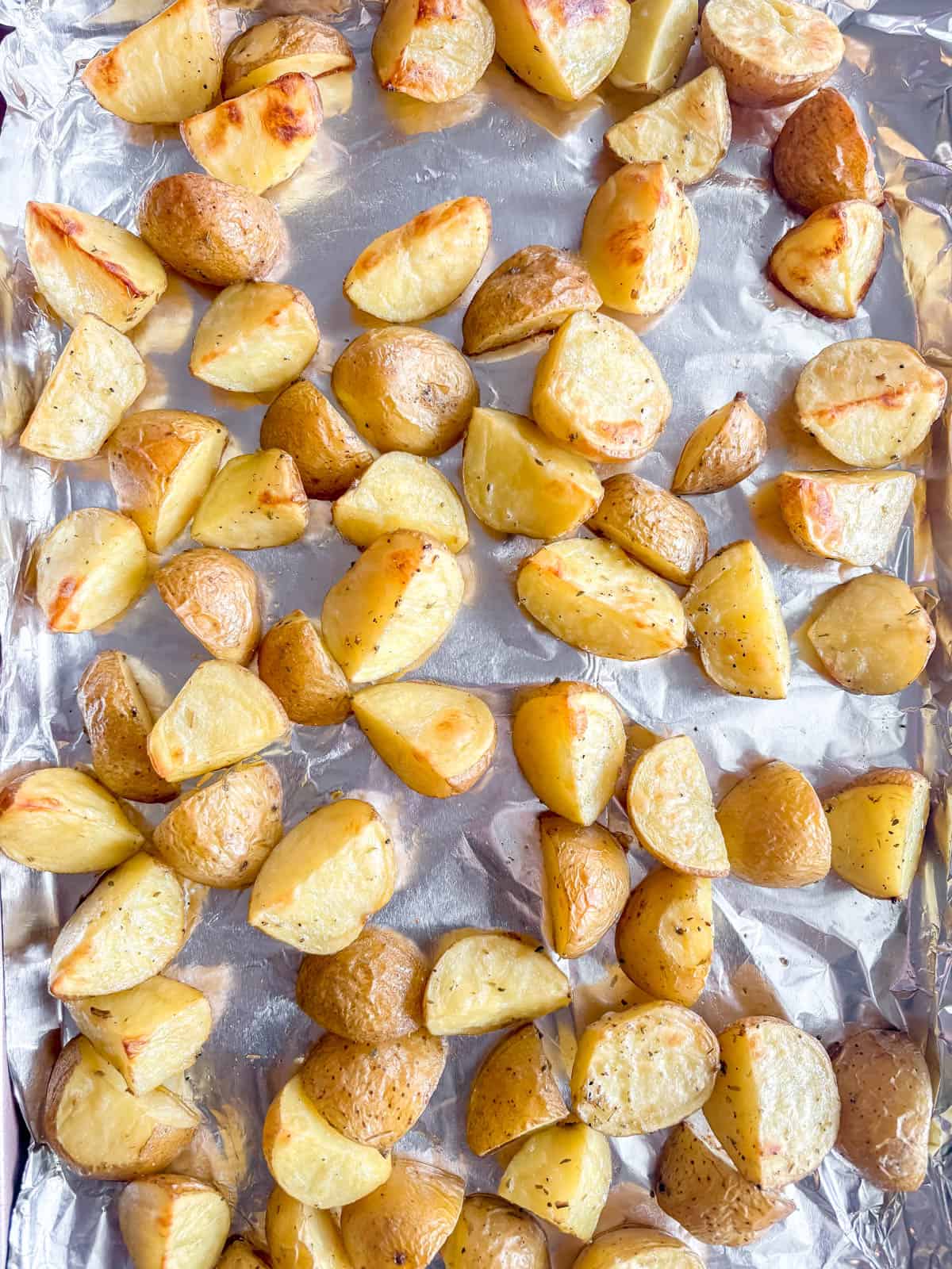 Roasted potatoes on a cookie sheet.