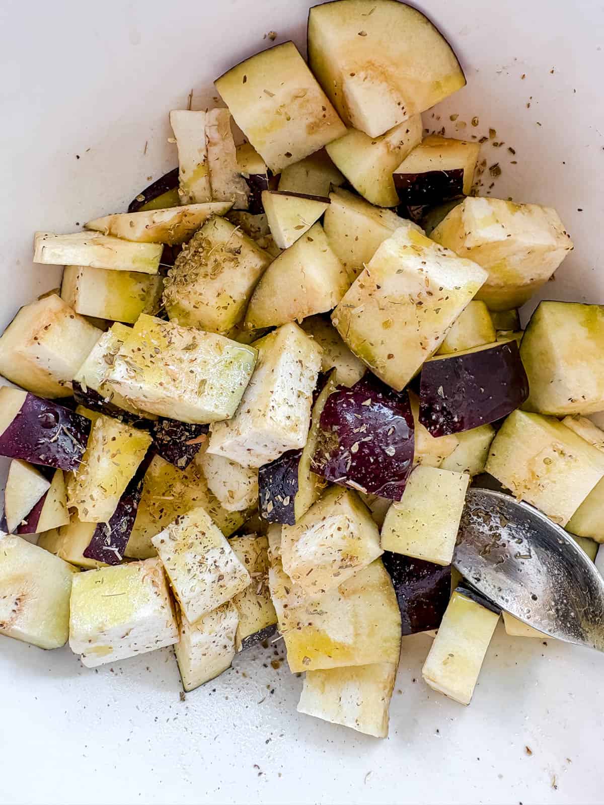 Diced eggplant in a bowl.