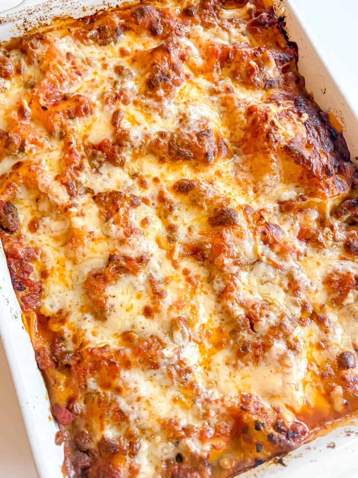 A freshly baked pan of lasagna with no boil noodles, ground beef, and greek yogurt.
