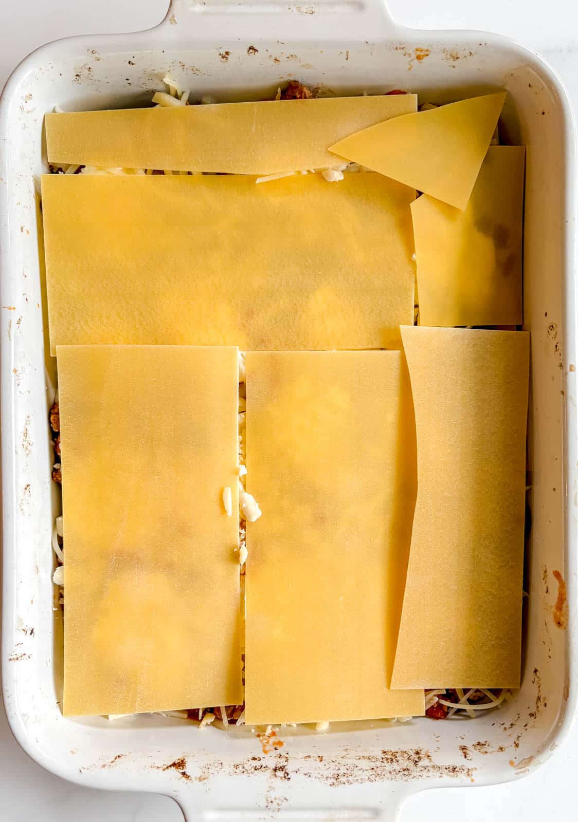 Another layer of no boil lasagna noodles in the dish.