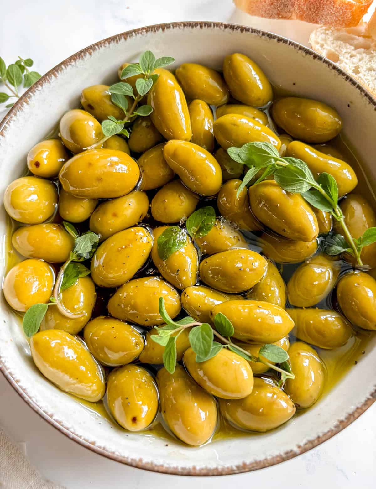 Balsamic olives in oil in a bowl.