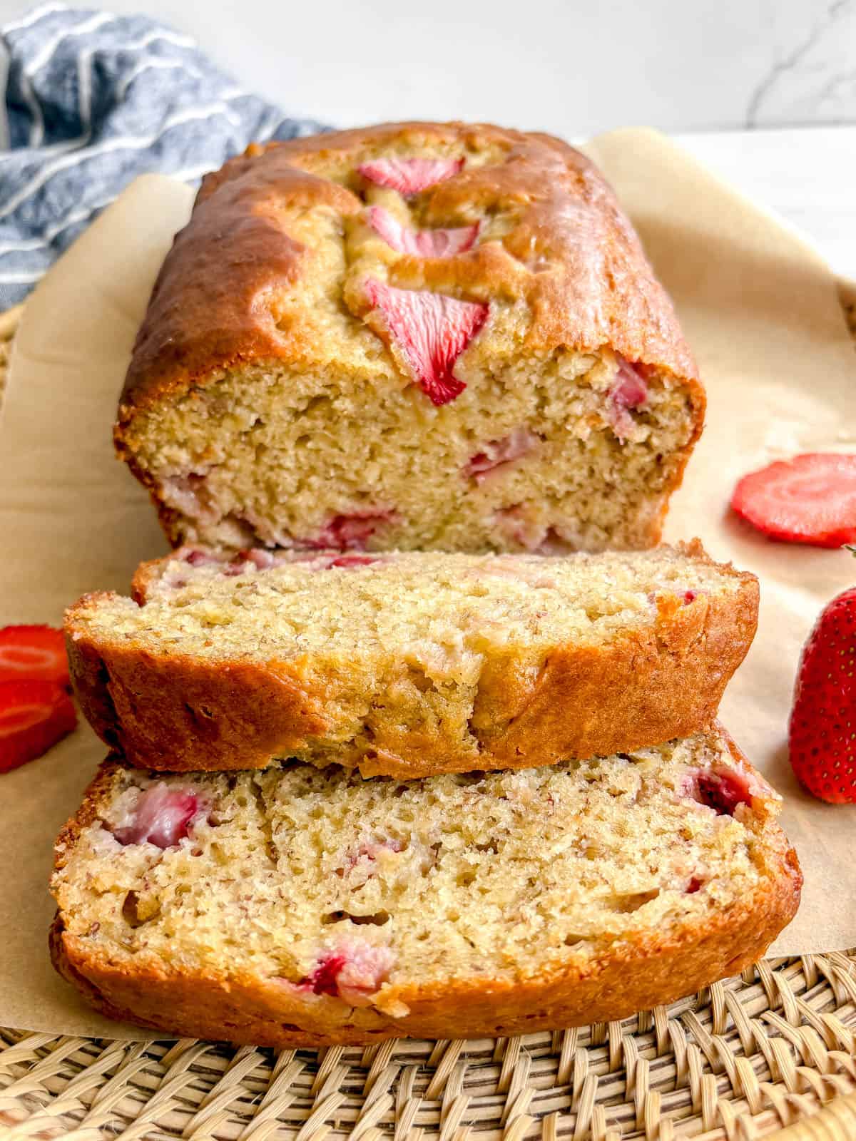 A few slices of strawberry banana loaf on a plate.